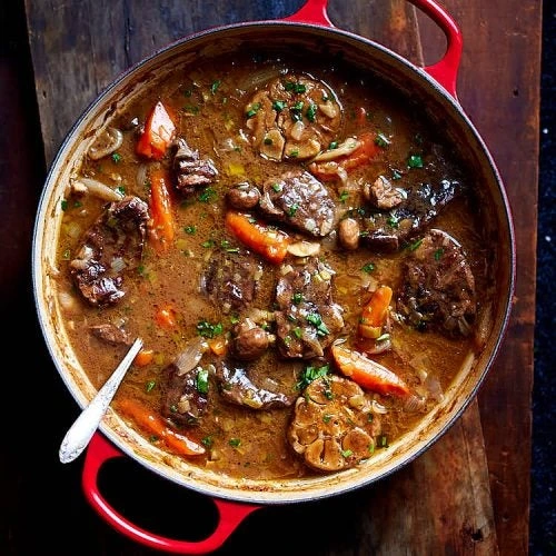 Slow-cooked beef stew with mushrooms, carrots and herbs